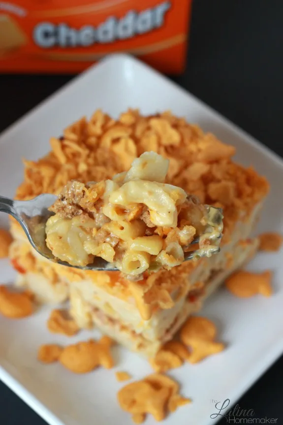 Baked Macaroni and Cheese Fiesta. A twist to the traditional baked macaroni and cheese recipe that includes ground meat and peppers with a cheesy crust. 