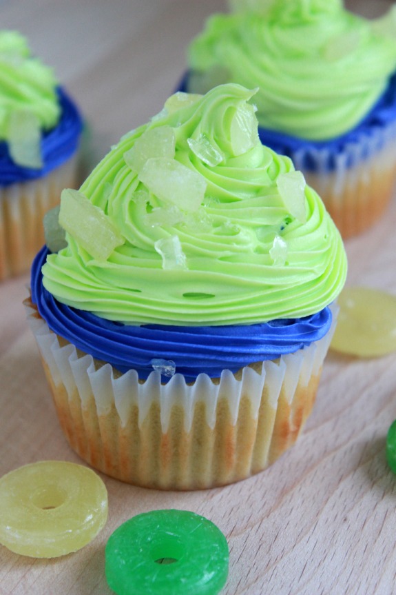 Game Day Vanilla Cupcakes-A delicious vanilla cupcake recipe with sweet white vanilla icing and crushed Life Savers that can be customized for game day. 