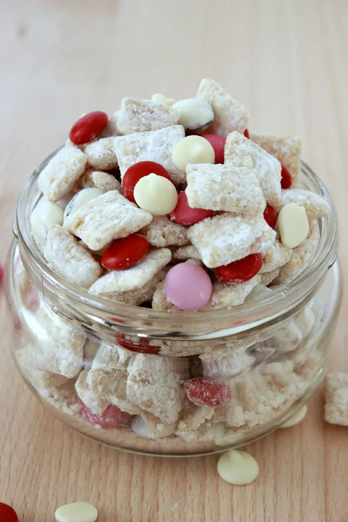 White Chocolate Muddy Buddies-A combination of white chocolate and vanilla frosted rice cereal make up this easy and delicious treat!