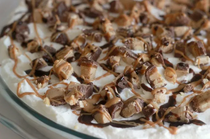 SNICKERS® Peanut Butter Pie. A delicious combination of peanut butter and chocolate that makes this easy peanut butter pie a recipe your family will love.