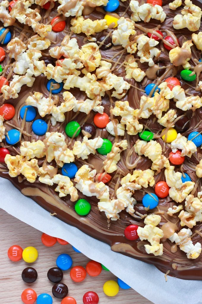 Movie Night Chocolate Bark-A chocolate peanut butter bark that is topped with popcorn and chocolate candies for a fun and delicious movie night snack!