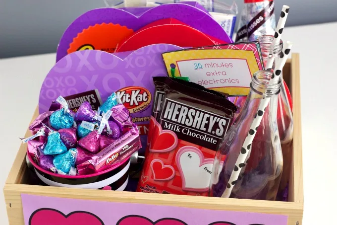 Valentine's Day Family Basket~Fun and simple ideas to help you create an inexpensive family basket for Valentine's Day! Includes FREE printable reward coupons and easy recipe!
