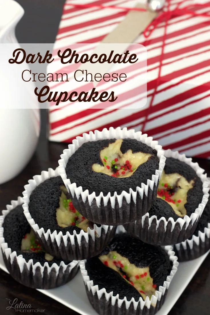 Dark Chocolate Cream Cheese Cupcakes. A moist dark chocolate cupcake that is filled with a cheesecake-like center. A recipe that will be a hit during the holidays and beyond! 