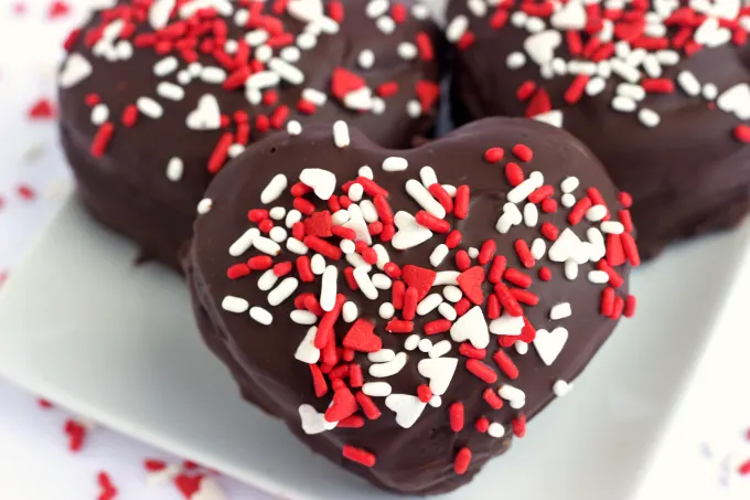 Dark Chocolate Raspberry Mini Cakes. A dark chocolate mini cake with a smooth raspberry cream cheese filling. Perfect for Valentine's Day and beyond! 