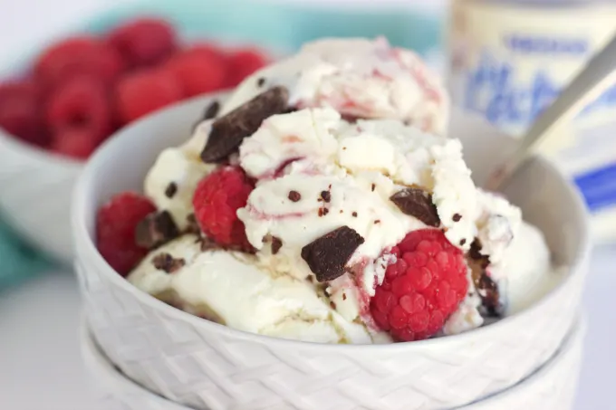 No Churn Vanilla Raspberry Swirl Ice Cream. A creamy vanilla ice cream with raspberry swirls and dark chocolate chunks.